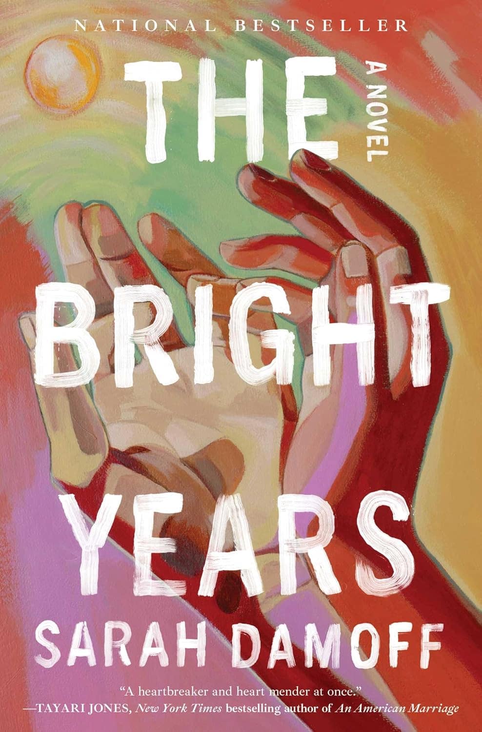 Book cover showing a colorblock image of 2 hands reaching towards the sun
