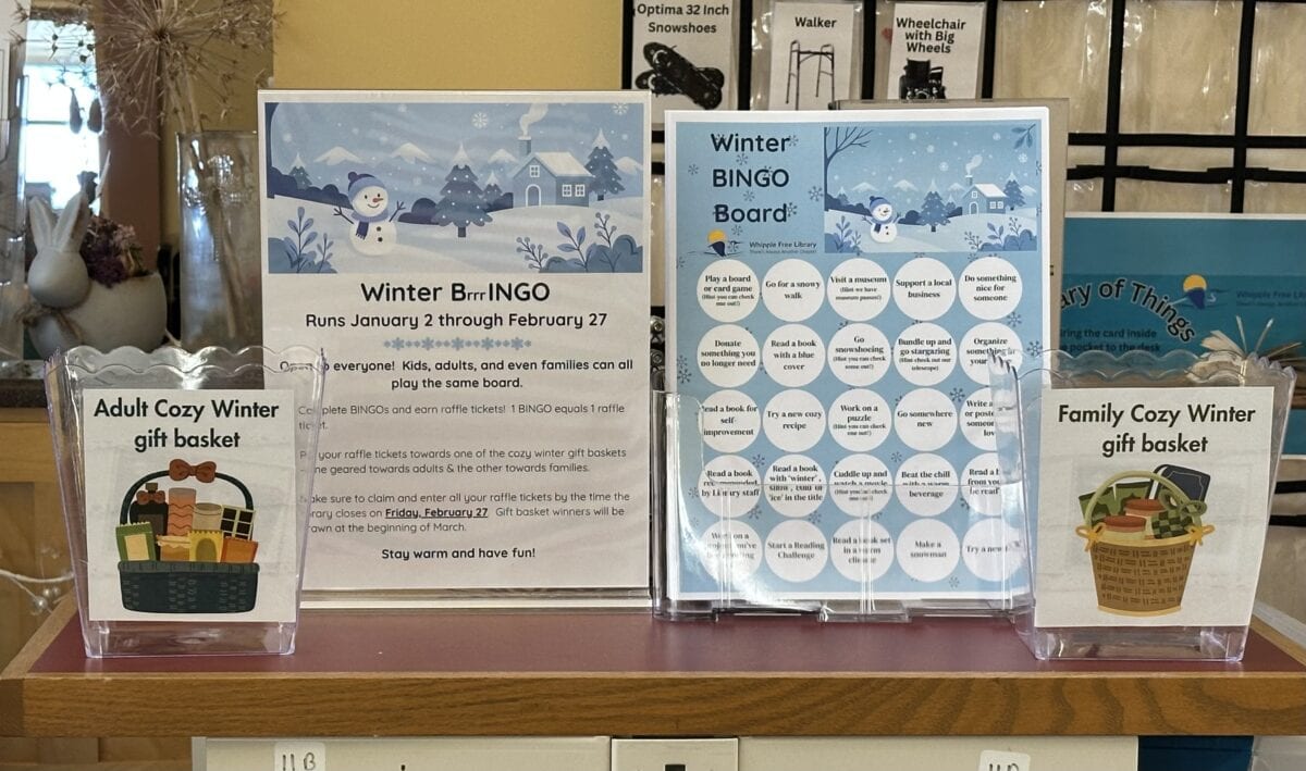 Winter BINGO display with instructions, handouts, and raffle jars