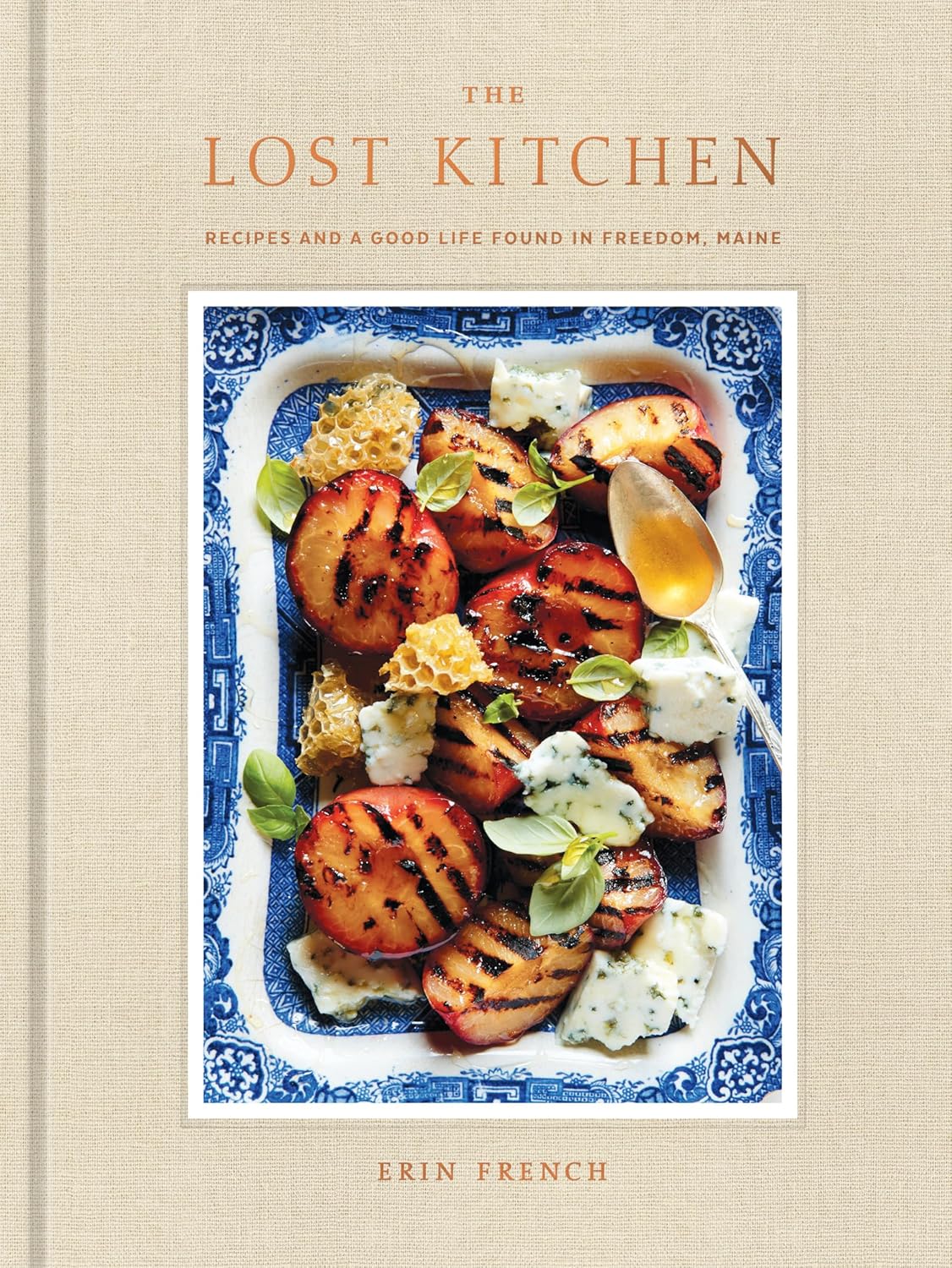 Book cover showing grilled peaches, cheese, and honeycomb on an intricate blue serving dish
