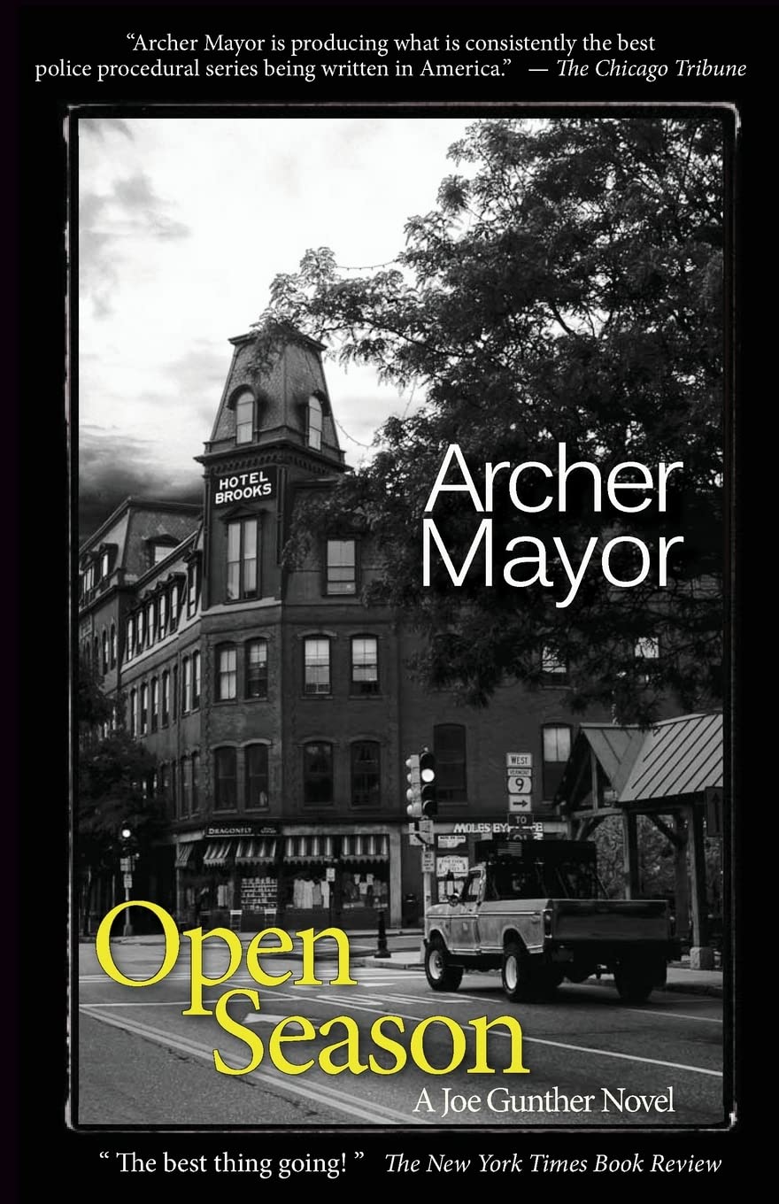 Black-and-white book cover showing an old-fashion downtown and a pickup truck stopped at a light