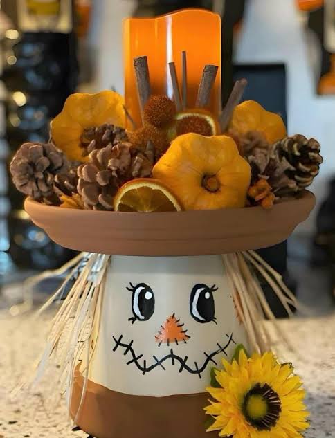 Fall scarecrow centerpiece made from terracotta pot.