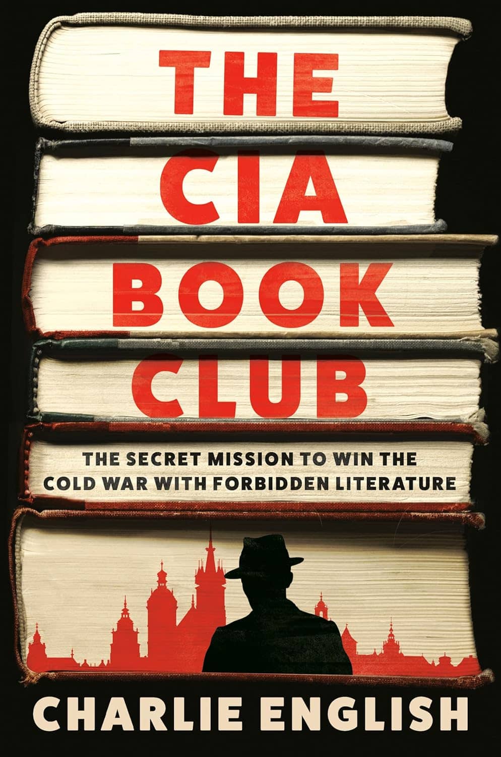 Book cover showing a stack of books end-on with the book title and a Russian skyline on the pages